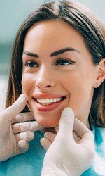 Dentist examining a patient’s smile