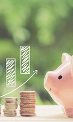 Increasingly taller stacks of coins next to a piggy bank
