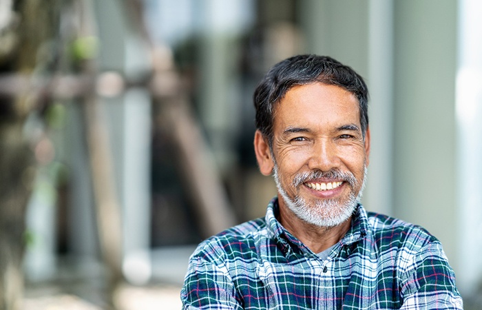 Man smiling outside