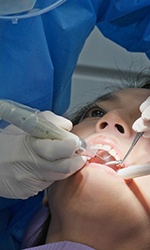 Woman having a dental crown placed