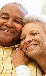 happy couple who have dentures questions answered