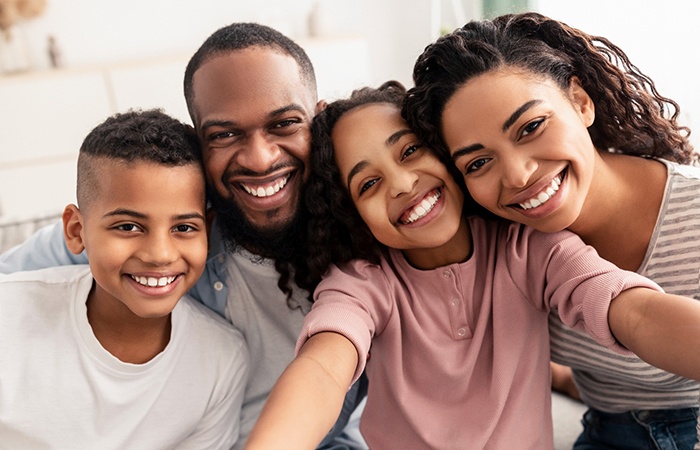 Happy family after receiving fluoride treatment in Studio City