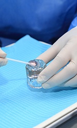 Dentist mixing up fluoride gel for application