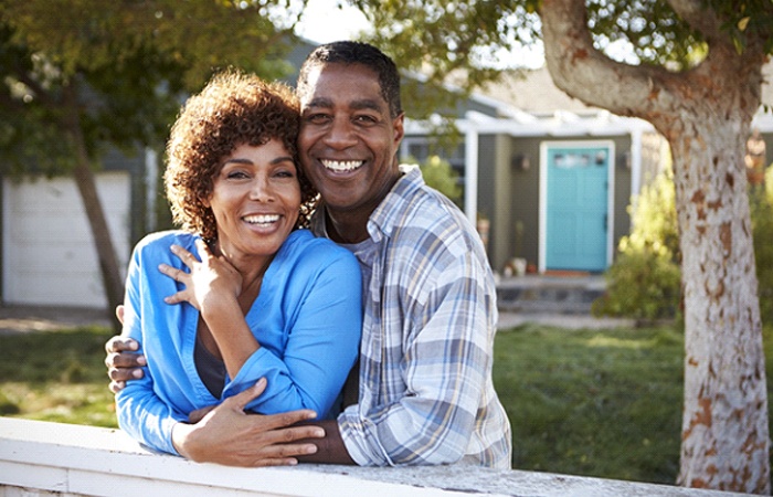 Couple wearing implant dentures in Studio City