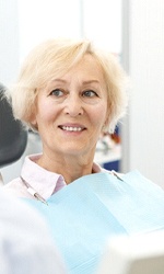 Woman learning dental implants in Studio City
