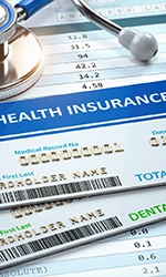 health insurance card on top of dental insurance card
