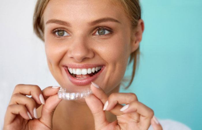 Woman smiling with Invisalign