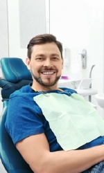 Man smiling in dental chair