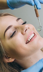 Woman receiving dental exam