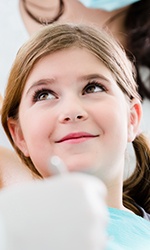 Young girl in dental chair