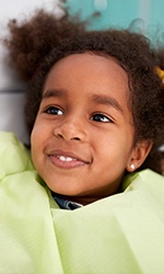 Smiling little girl in dental chair