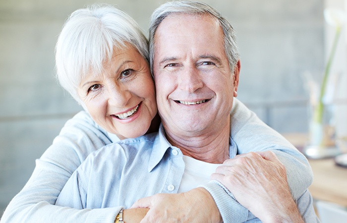 Older man and woman smiling