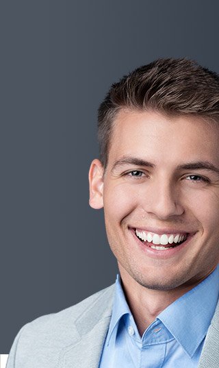 Smiling young man with glasses