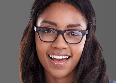 Young woman with straight teeth and glasses