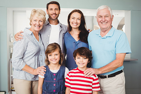 Three generations of family smiling together