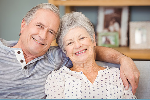 Older man and woman on couch