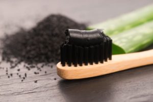 charcoal toothpaste on a toothbrush