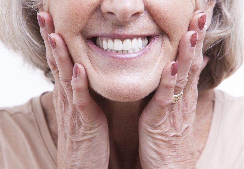 up-close view of woman’s smile with dentures 