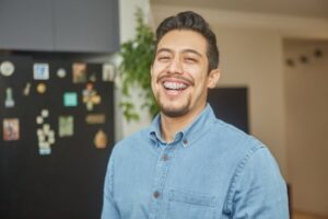 Man with braces smiling