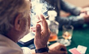 Older man smoking a cigarette